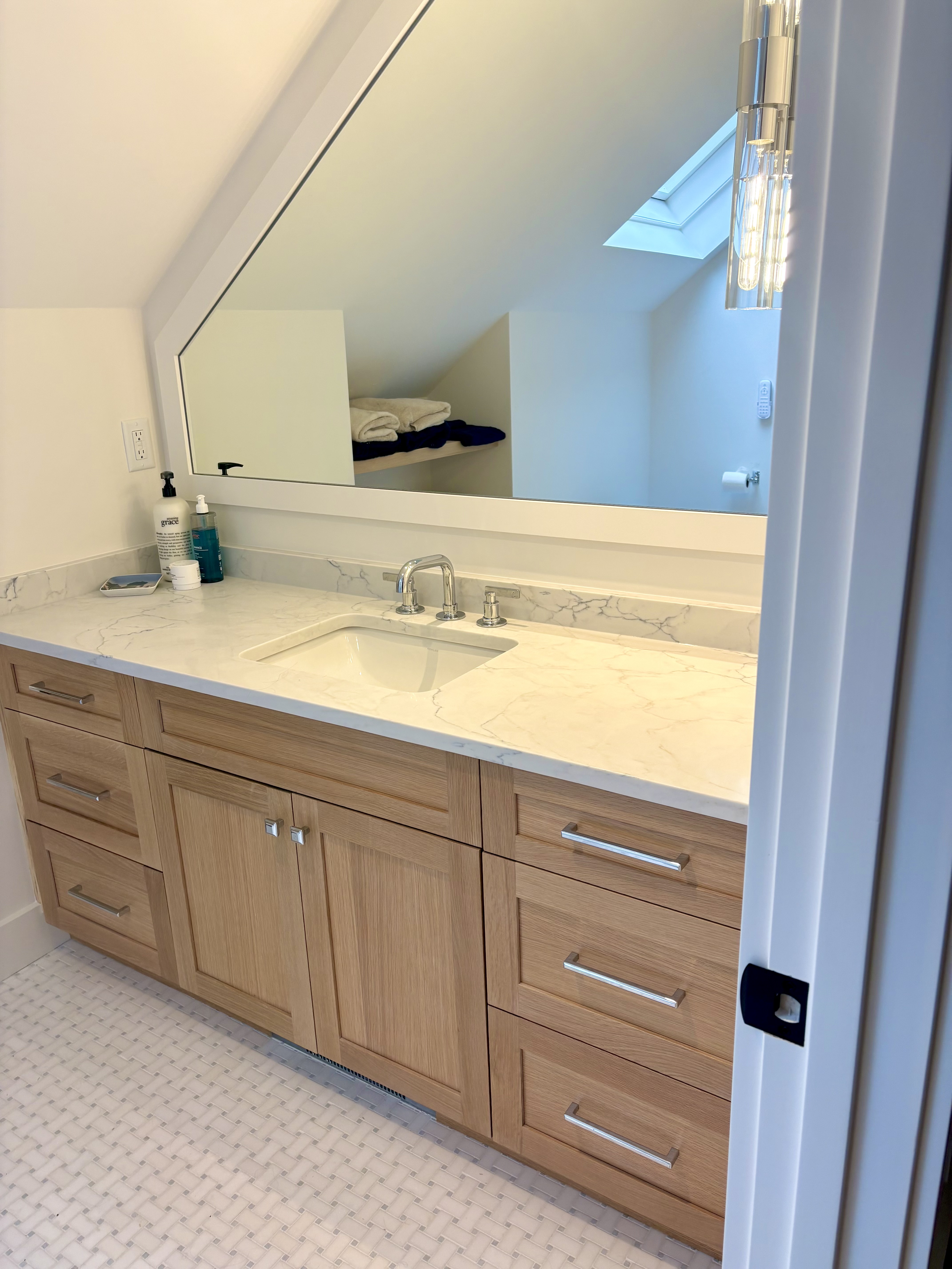 Large custom fitted mirror and marble counter
