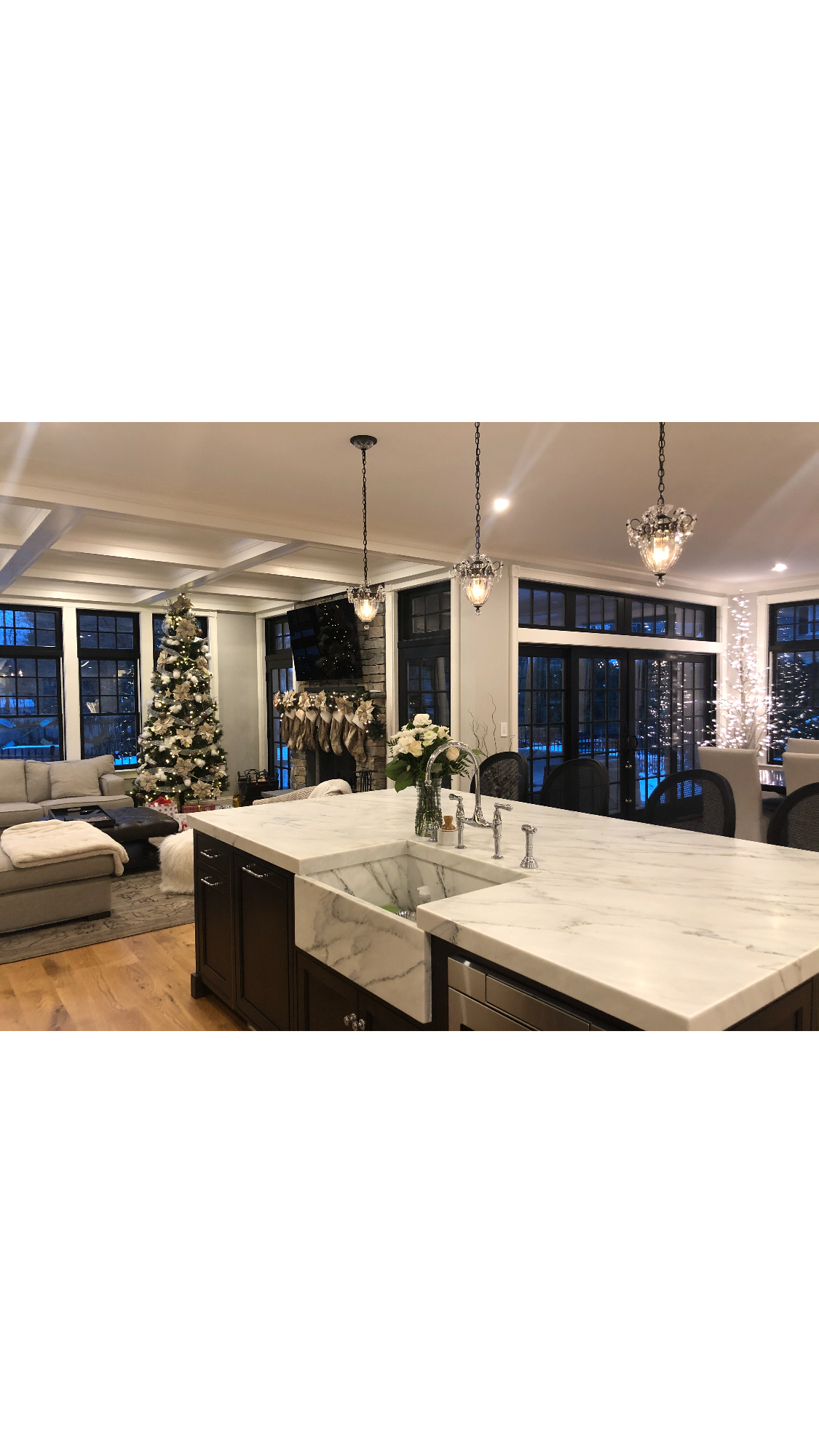 Kitchen with white marble island, and christmas decorations