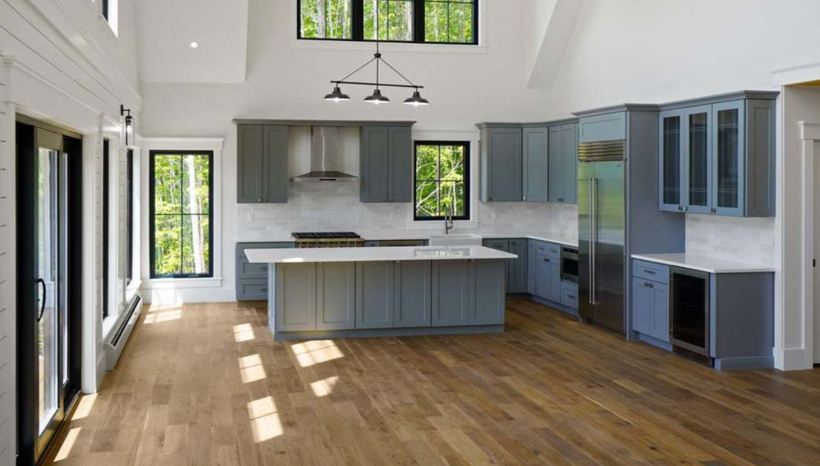 Kitchen with granite counter and grey cabinets